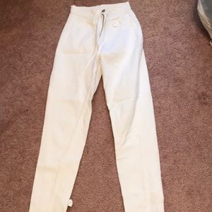 Jordache White Skinny Jeans with bows and zippers on bottoms